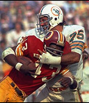 Manny Fernandez tackles Larry Brown.